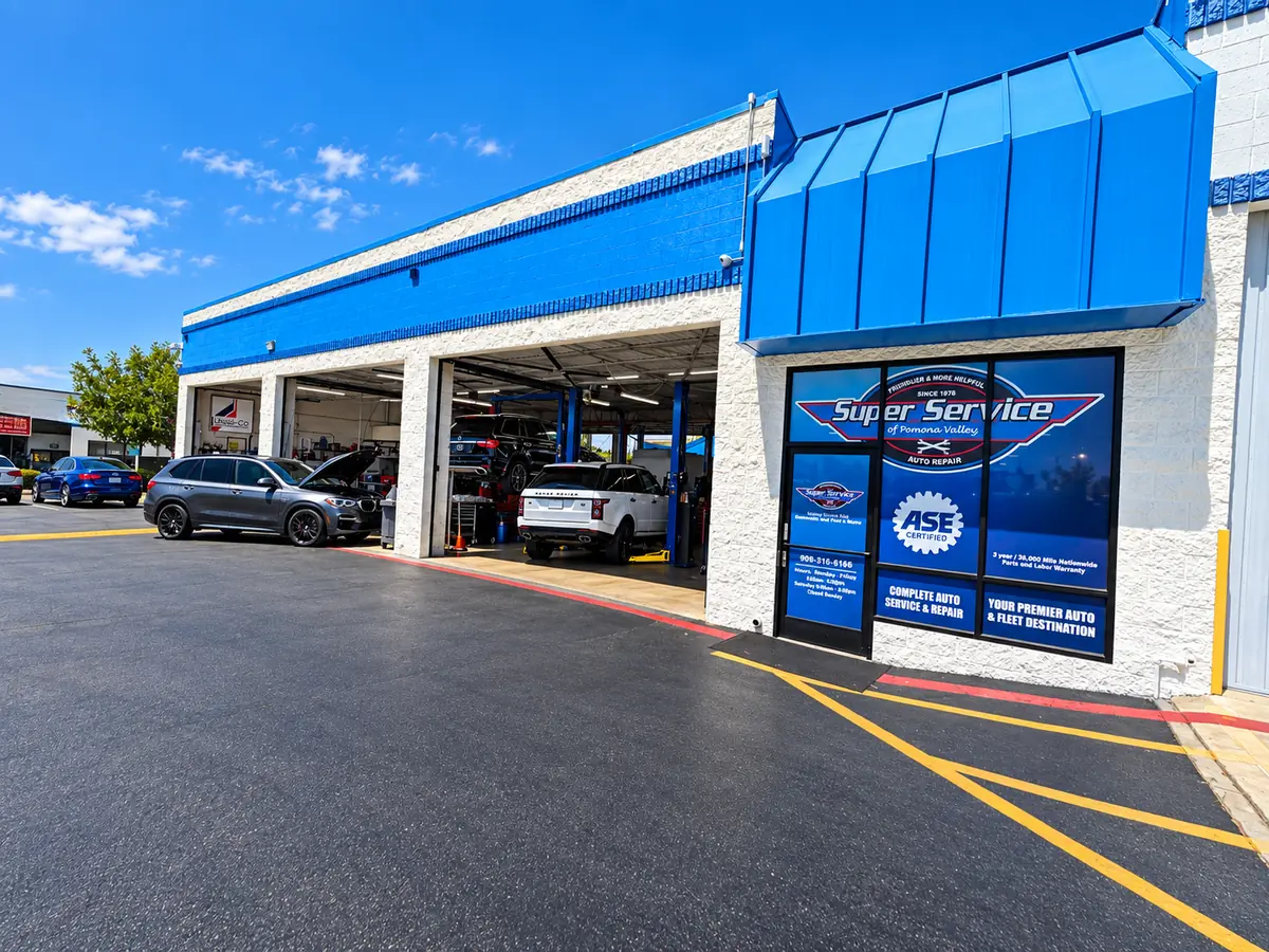 Super Service of Pomona Valley storefront with open service bays and the ASE Certified emblem in the front window